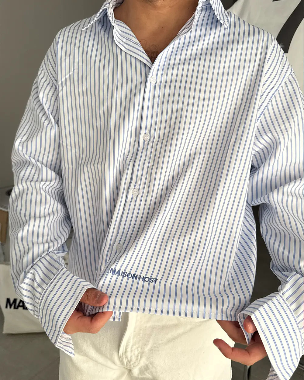 CAMISA RAYADA AZUL CON COSTURAS