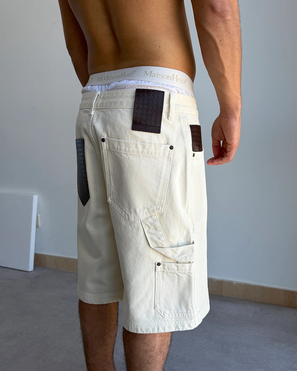 LEATHER POCKET ECRU SHORTS